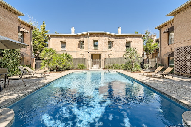 view of swimming pool with a patio area