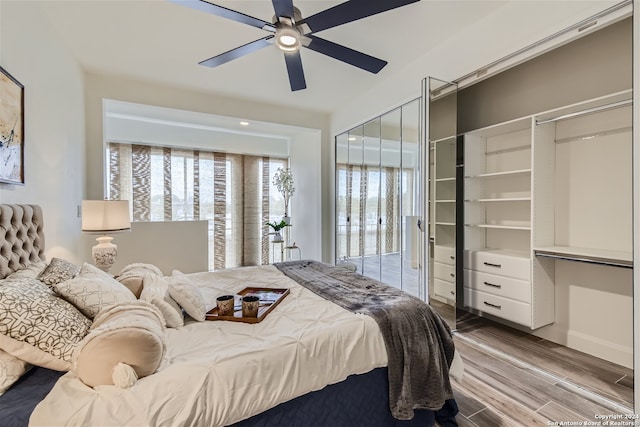 bedroom featuring ceiling fan and light hardwood / wood-style floors