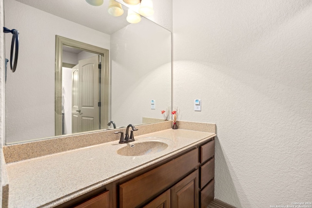 1007 Boulder Cyn, San Antonio, TX 78260 - bathroom featuring a textured wall and vanity