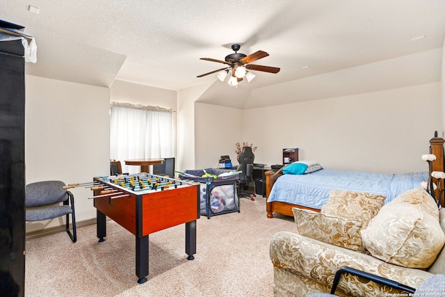 bedroom with light carpet, a textured ceiling, and ceiling fan