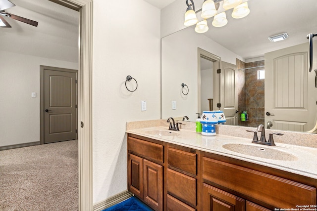 1007 Boulder Cyn, San Antonio, TX 78260 - bathroom with ceiling fan, a sink, double vanity, and tiled shower