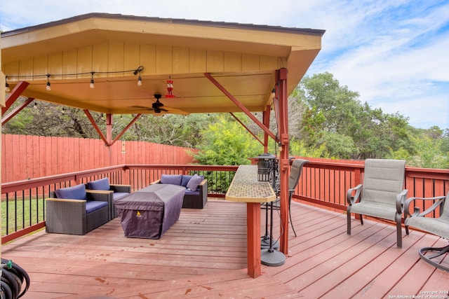 deck featuring an outdoor hangout area and ceiling fan