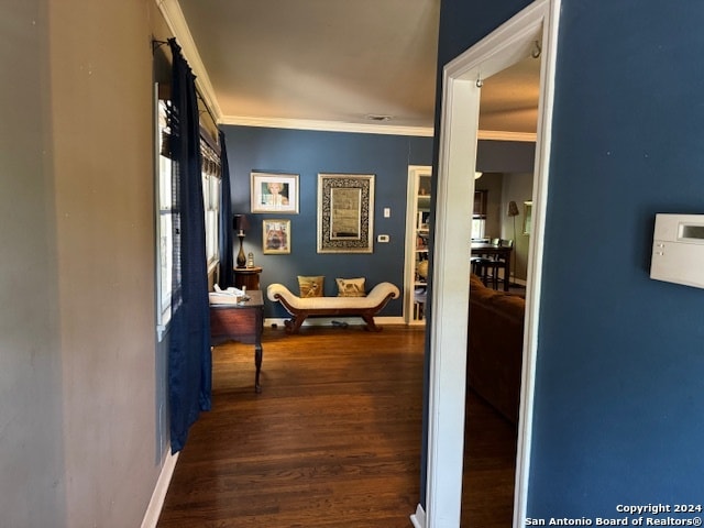 corridor with ornamental molding and dark hardwood / wood-style floors