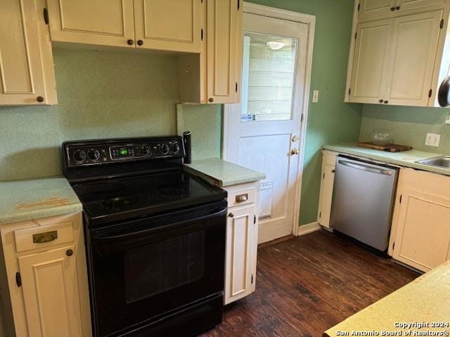 kitchen featuring black range with electric stovetop, dark wood-type flooring, and stainless steel dishwasher