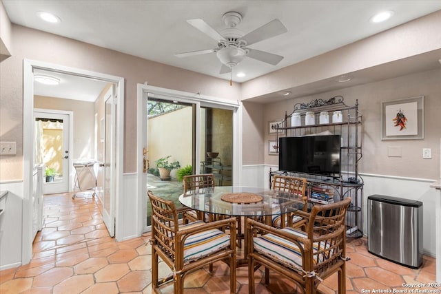 tiled dining room with ceiling fan