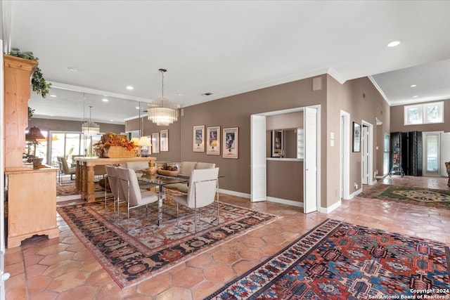 tiled dining room featuring crown molding and a chandelier