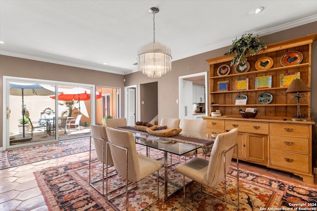 dining space with ornamental molding, light tile patterned flooring, and a chandelier