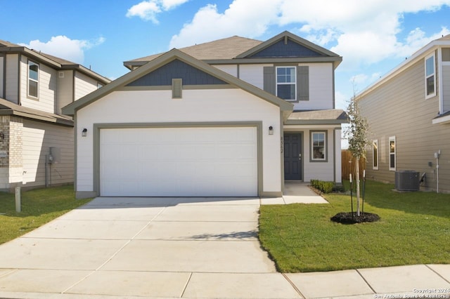 view of front of home featuring a garage, central AC unit, and a front lawn