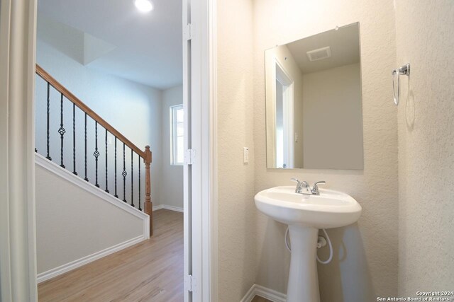 bathroom featuring hardwood / wood-style flooring