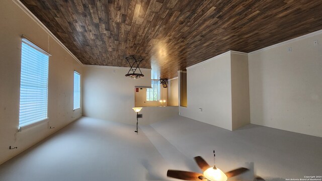 unfurnished living room with crown molding, wooden ceiling, ceiling fan, and concrete flooring