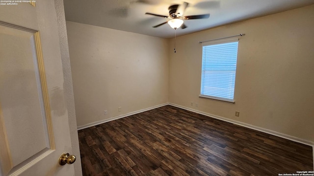 unfurnished room featuring ceiling fan, baseboards, and dark wood-type flooring