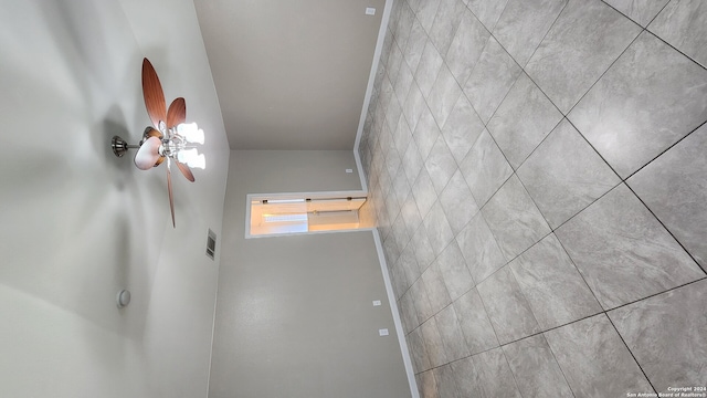 spare room with ceiling fan