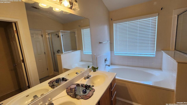 full bath with a garden tub, double vanity, visible vents, a stall shower, and a sink