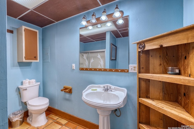 bathroom featuring tile patterned flooring and toilet