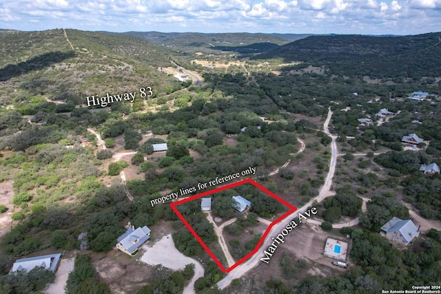 birds eye view of property featuring a mountain view