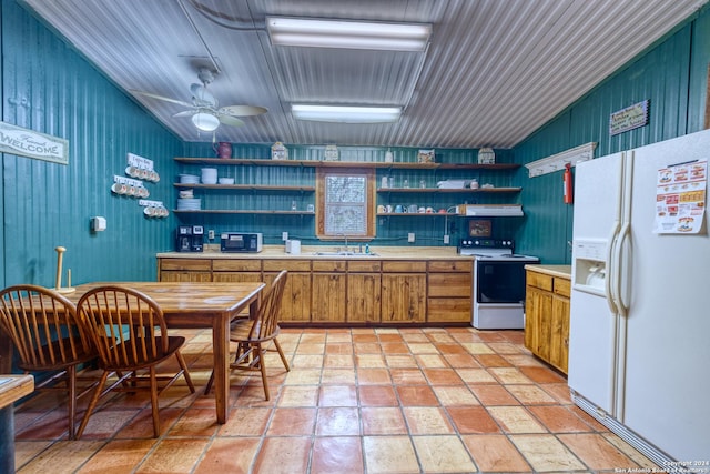 kitchen featuring ceiling fan, sink, and white appliances