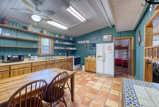 kitchen featuring vaulted ceiling, sink, ceiling fan, and white appliances