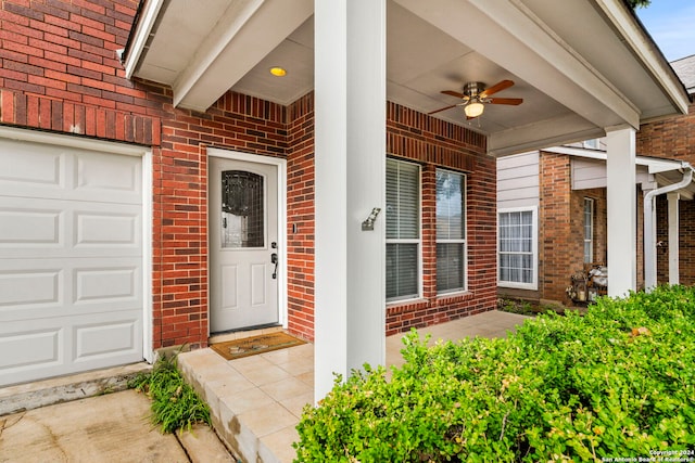 view of exterior entry featuring ceiling fan