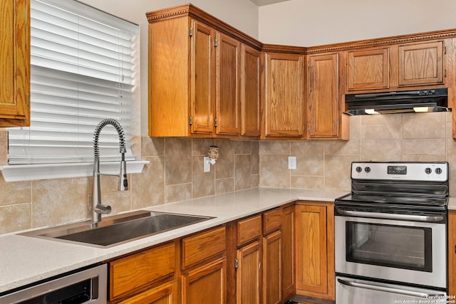 kitchen with sink, backsplash, dishwashing machine, and stainless steel electric range