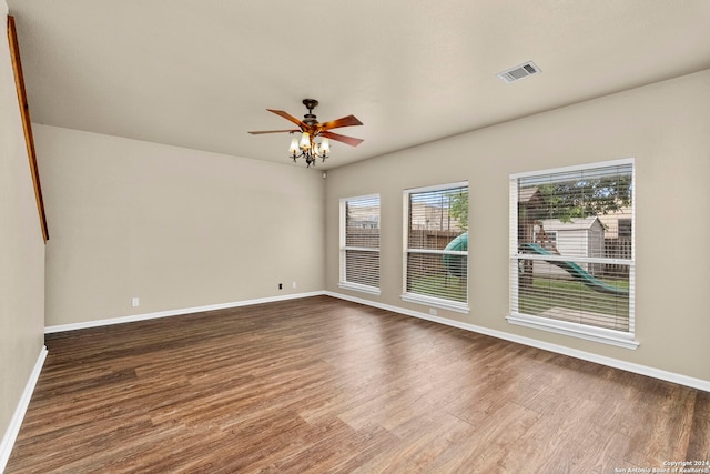 empty room featuring ceiling fan and hardwood / wood-style floors