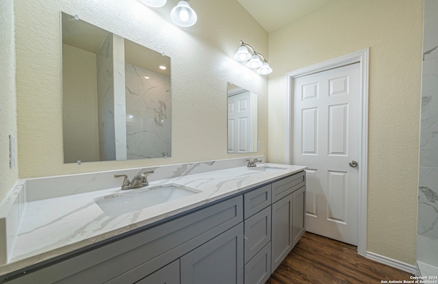 bathroom featuring vanity and hardwood / wood-style floors