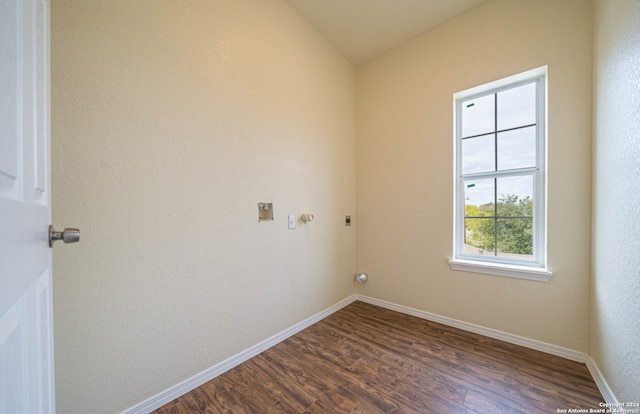 laundry area with gas dryer hookup, hookup for an electric dryer, and dark hardwood / wood-style flooring