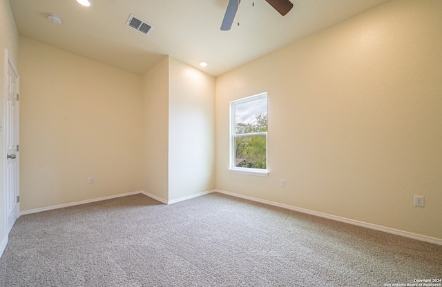 empty room featuring carpet and ceiling fan