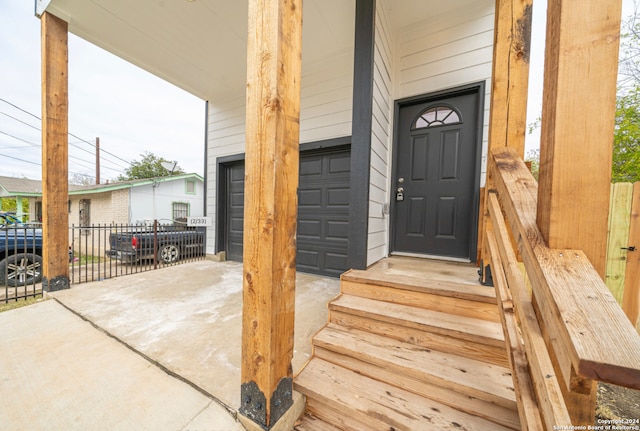 view of exterior entry with a garage