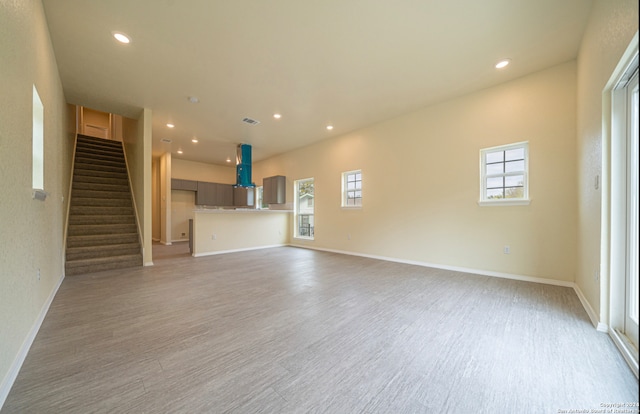 unfurnished living room featuring light hardwood / wood-style floors