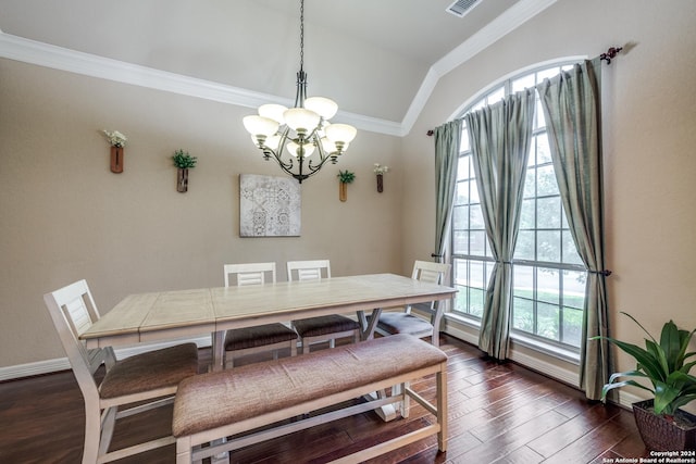 dining space featuring dark hardwood / wood-style flooring, crown molding, lofted ceiling, and a healthy amount of sunlight