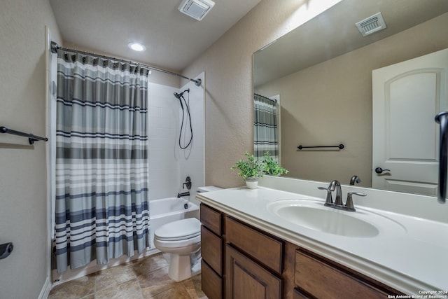 full bathroom featuring vanity, toilet, and shower / bath combo