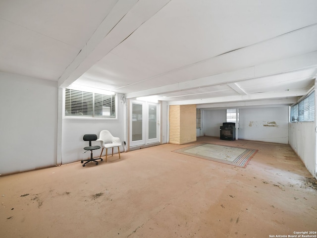 unfurnished living room with brick wall