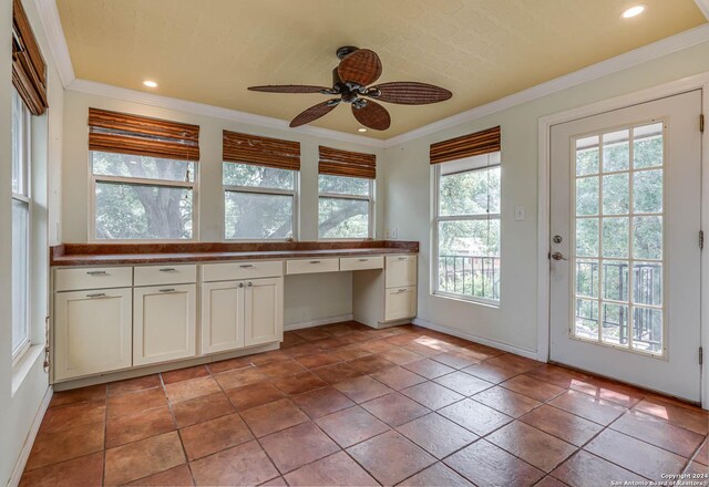 kitchen featuring light tile patterned flooring, ceiling fan, and plenty of natural light