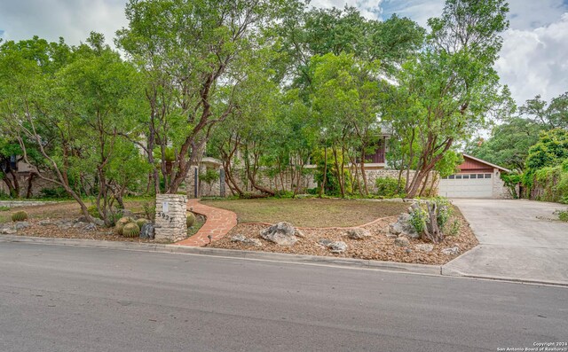 view of property hidden behind natural elements