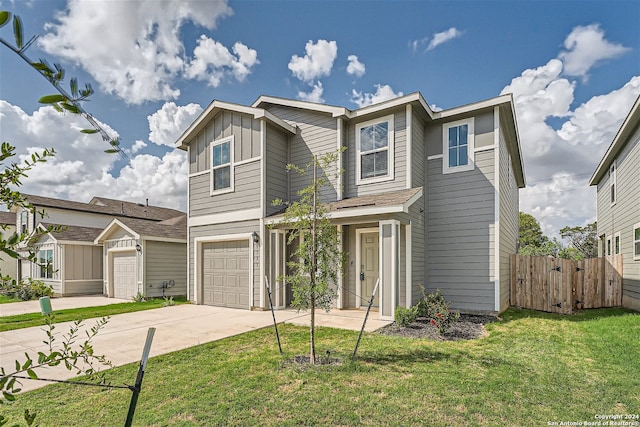 view of front of property with a garage and a front yard