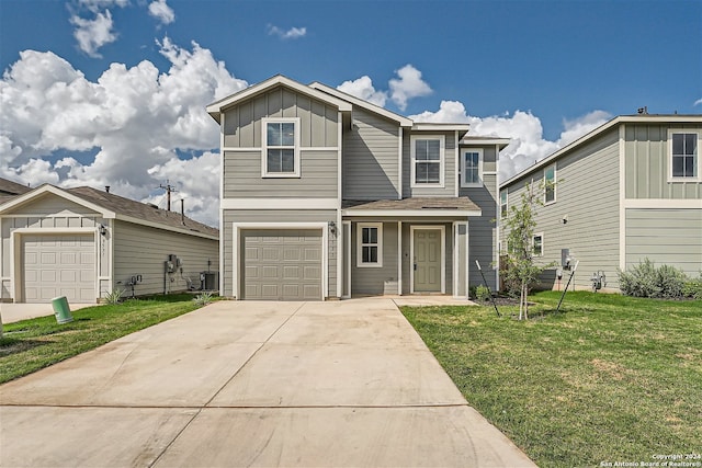 view of property with central AC unit, a garage, and a front yard