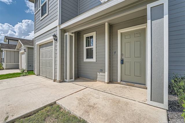 property entrance with a garage