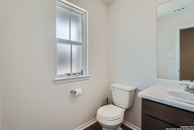 bathroom with vanity and toilet