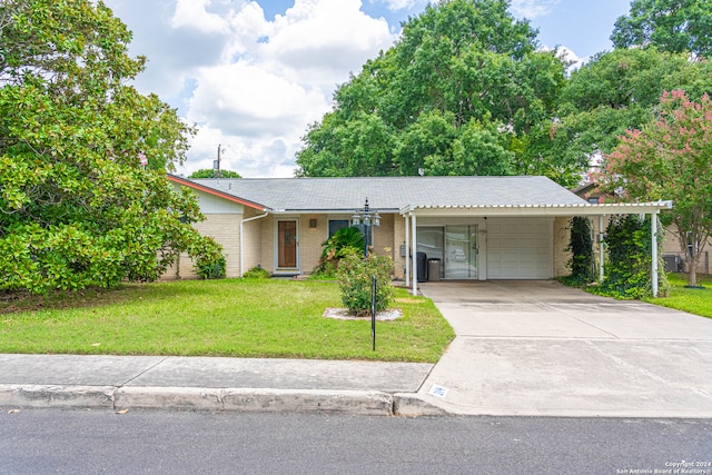 ranch-style house with a garage and a front yard