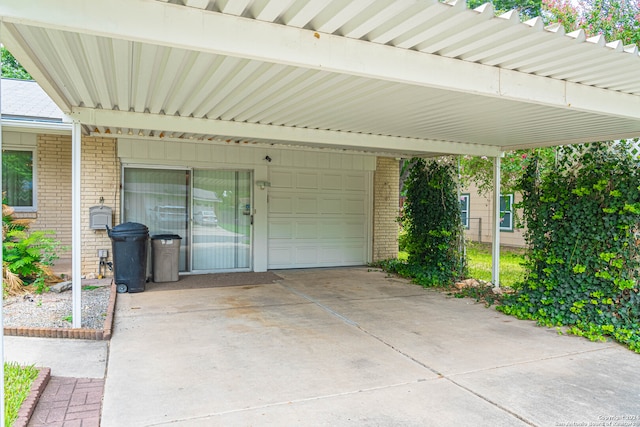 view of patio / terrace with a garage and a carport