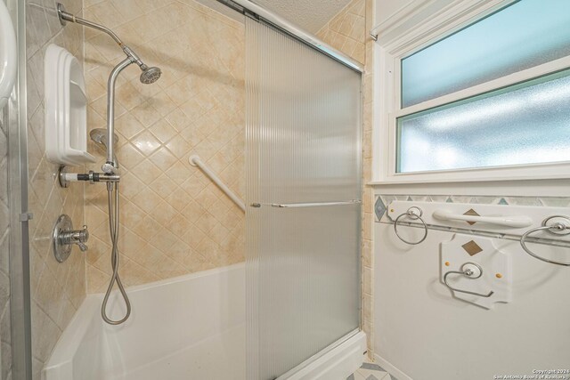 bathroom with a shower with shower door