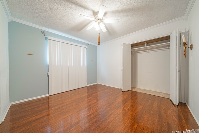 unfurnished bedroom with ceiling fan, hardwood / wood-style floors, and crown molding