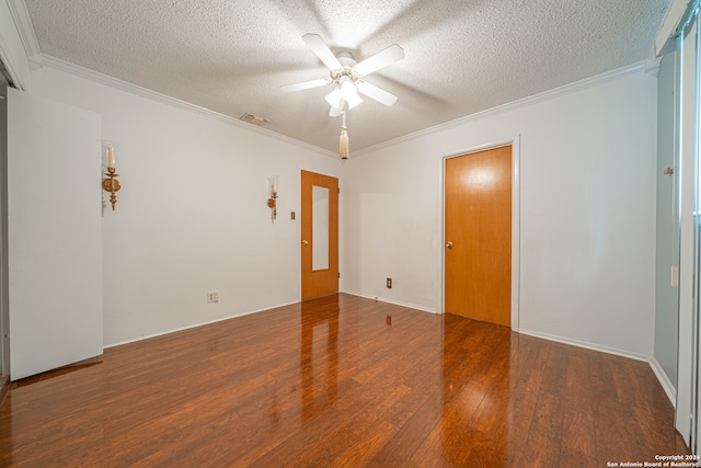 empty room featuring crown molding, a textured ceiling, ceiling fan, and wood-type flooring