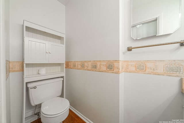 bathroom featuring tile patterned floors and toilet