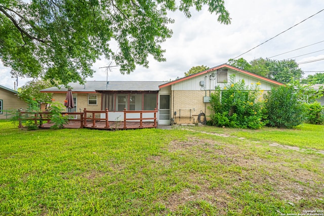 back of house with a yard and a deck