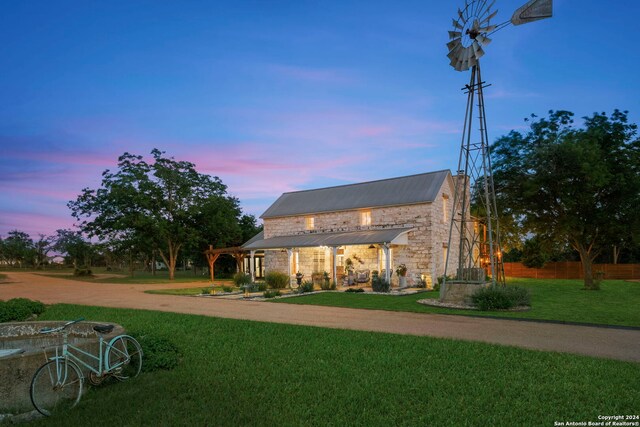 view of front facade featuring a porch and a lawn