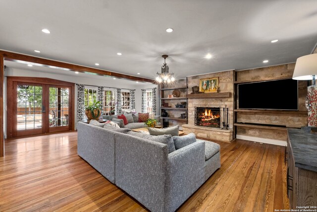 dining area featuring ornamental molding, a chandelier, and light wood-type flooring