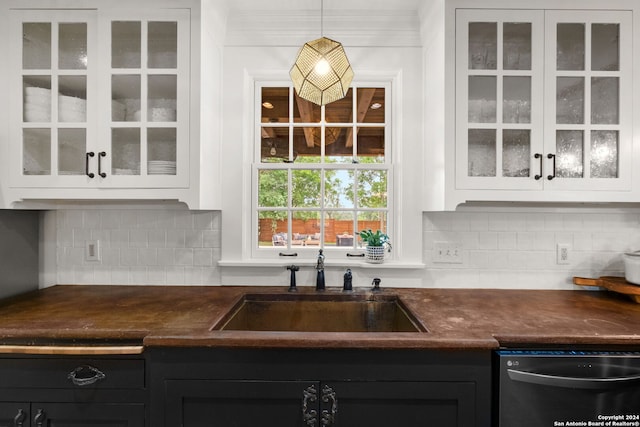 bar featuring decorative light fixtures, decorative backsplash, dishwasher, and sink