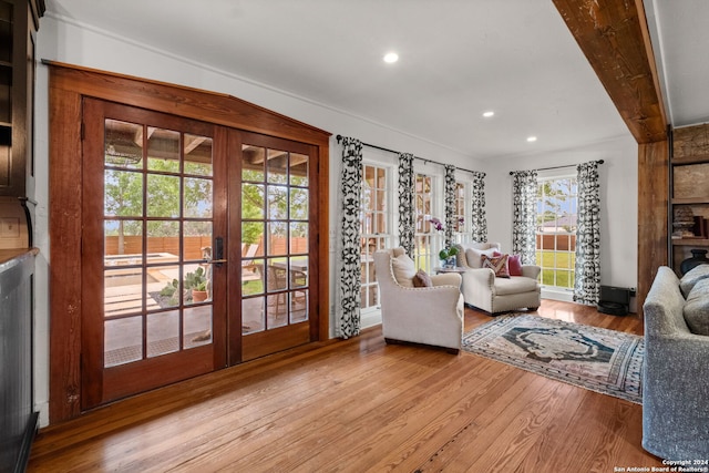 living room featuring light wood-type flooring and french doors