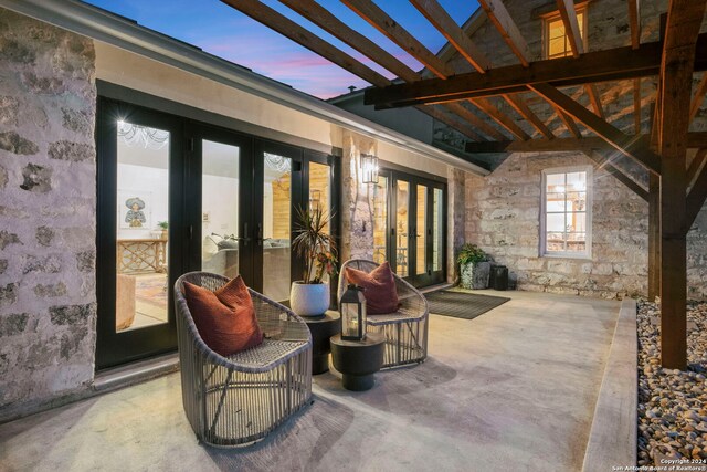 living room with wood walls, ceiling fan, a wall mounted air conditioner, french doors, and high vaulted ceiling